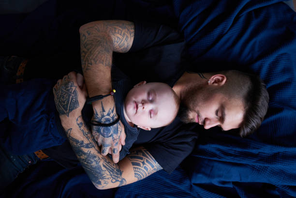 Father Hugging Baby And Sleeping Stock Photo - Download Image Now - Tattoo, Father, Baby - Human Age - iStock Father Hugging Baby And Sleeping Stock Photo - Download Image Now - Tattoo, Father, Baby - Human Age - iStock