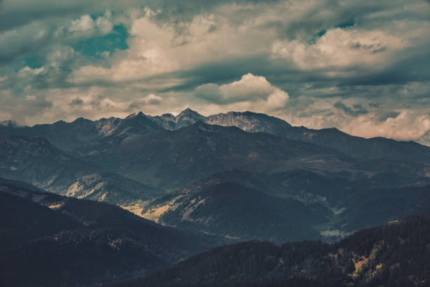 mountain landscape, mountains in the clouds at sunset