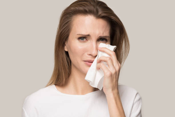 istock Unhappy depressed young woman crying, wiping tears, personal problem 1162203180