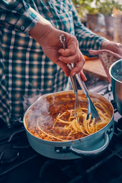 istock Preparing Spaghetti Bolognese in Domestic Kitchen 1162205709