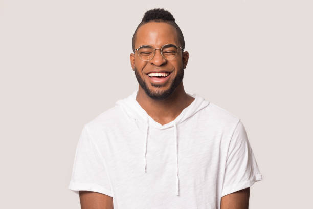 istock Laughing attractive mixed race guy in glasses studio shot 1162206911