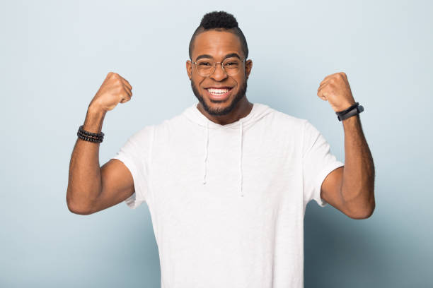istock Happy young black guy celebrating lottery win. 1162206932
