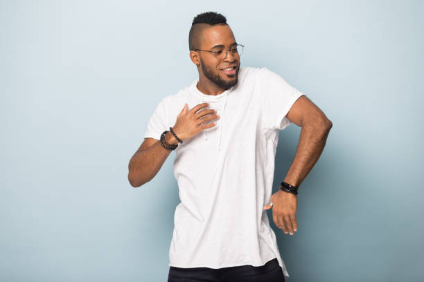 Happy smiling black man in eyeglasses dancing.