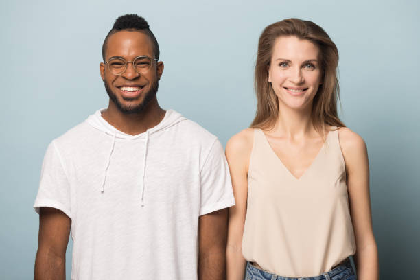 istock Happy smiling multiracial couple standing next to each other. 1162206946