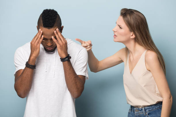 istock Angry young woman blaming black sad man. 1162206948