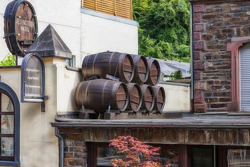 Cochem, Germany - August 02, 2014: Wine barrels on the canopy of a hotel and wine bar in the city of Cochem at the Mosel in Germany.