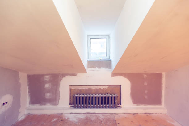 istock Heating cast-iron radiator  in apartment that is under construction, remodeling, renovation, overhaul, extension, restoration and reconstruction. Concept of home improvement 1162207143