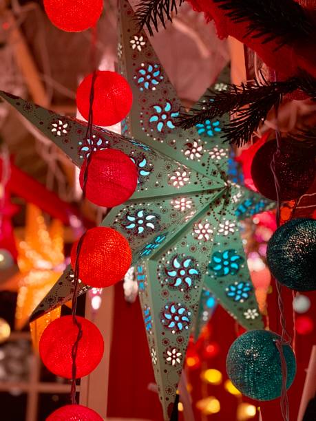 istock Traditional christmas lantern in star shapeand garlands 1162209476