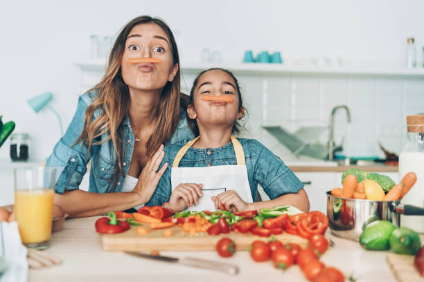 Mother and daughter with carrot mustaches