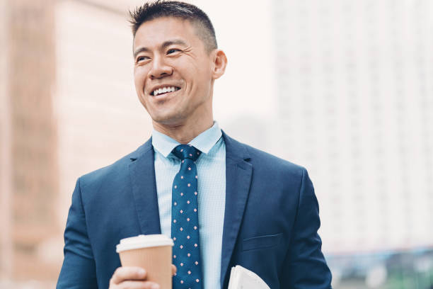 smiling asian ethnicity businessman - business business person ceo coffee imagens e fotografias de stock