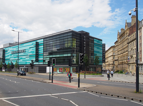 bradford, west yorkshire, united kingdom -14 june 2019: a view of bradford city center from the broadway road with the large debenhams department store and shopping centre and surrounding streets