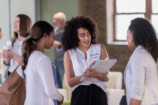 istock Official greeter takes down information about new members 1162212442