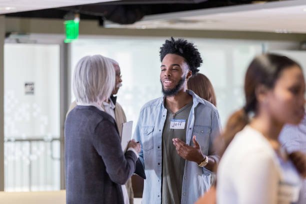 istock Young adult man talks with association president 1162212453