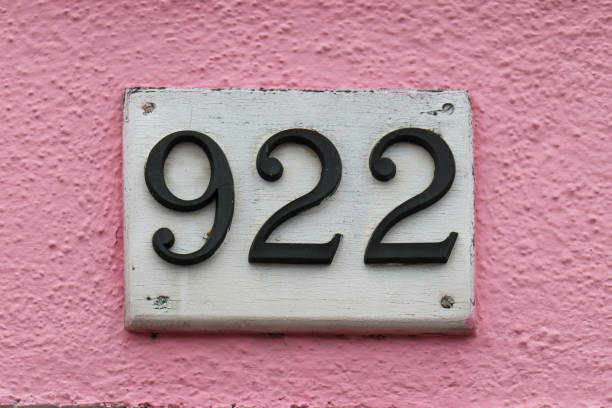 House number on pink facade