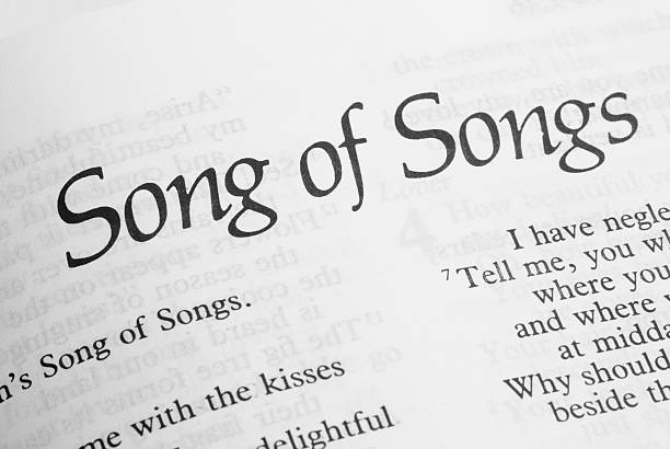 An old book of Gospel hymns isolated on white.