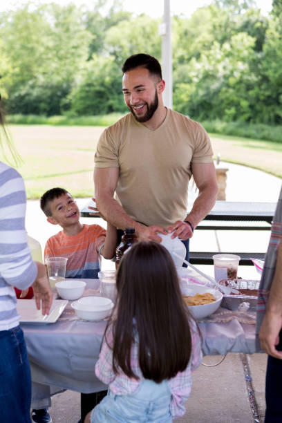 istock Uncle laughs and entertains children 1162213520