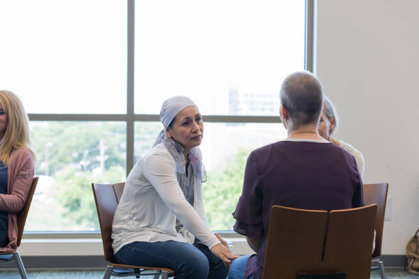 istock Older woman comforts unrecognizable young woman 1162213634