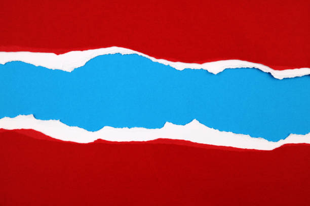 istock Ripped paper on blue 1162213744