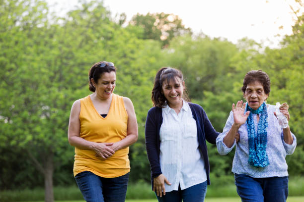istock Senior mom walks with two adult daughters 1162215271