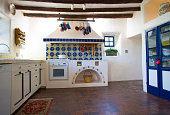 Rustic Southwest USA Kitchen: Brick Floor, Beams, Oven, Counters