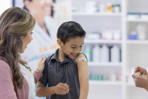 istock Young boy receives bandage after vaccine 1162215578