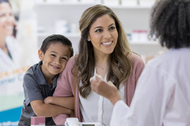 istock Cheerful woman talks with female pharmacist 1162215590