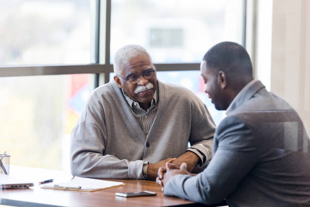 istock Senior man meets with financial advisor 1162215606