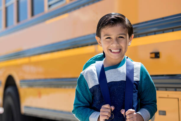 istock Excited mixed race schoolboy 1162215671