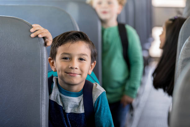 istock Adorable schoolboy on school bus 1162215685