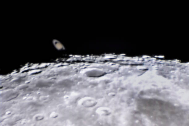 istock An amazing astronomy event, Saturn covered by the Moon surface awe night sky view from Santiago, Chile, polluted skies with an advanced amateur telescope. Saturn and its rings eclipse by the Moon 1162215756