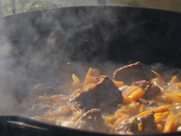 Hot meat cooking on fire with smoke macro shot