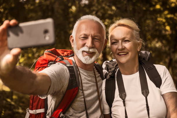 istock Senior couple hiking ,taking a break taking a selfie 1162221489