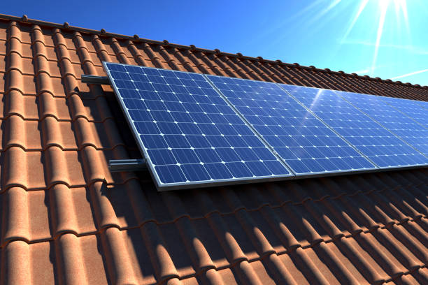 istock Solar panels modules on house roof with clear blue sky in background 1162222054