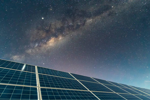 istock Solar Energy Panels view, a nice technology blue pattern at Atacama Desert arid lands. The solar modules going to the infinity with the Milky Way trying to get energy from the stars on the night sky and converting it into electricity an amazing night view 1162223648