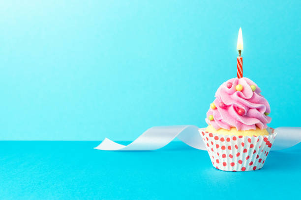 istock Colorful celebration background with cupcake. Minimal party concept. 1162223881