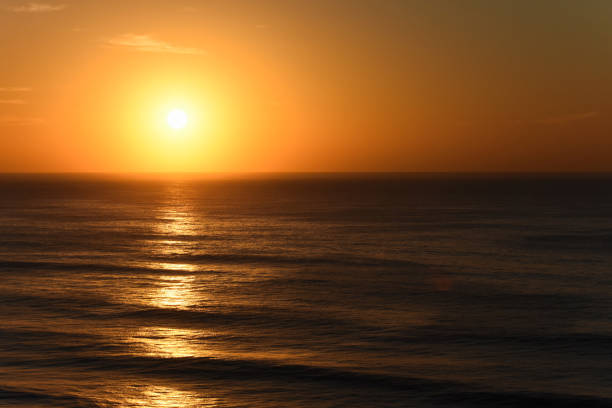 istock Orange Clear Sky Sunrise Over The Ocean 1162224978