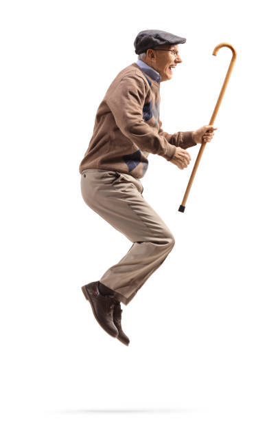 istock Elderly man jumping and holding a walking cane 1162225968