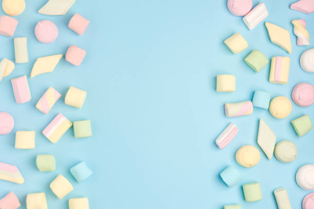 istock Blue paper background with marshmallow. Cozy sweet background 1162226008
