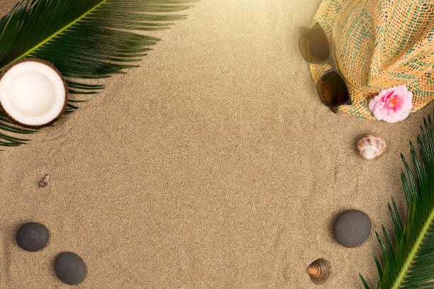 istock Summer flat lay with, sunglasses and panama hat on sand background 1162226017