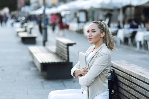 istock Woman using laptop outdoors in Porto 1162226165