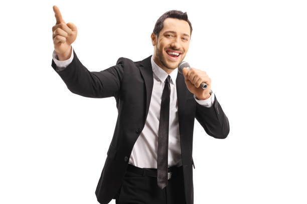 istock Handsome male singer with a microphone pointing up 1162226294