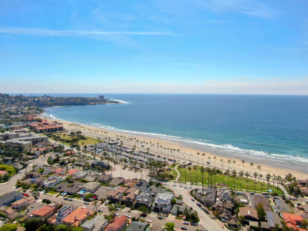 Aerial view of La Jolla coastline with beautiful villas. Aerial view of La Jolla coastline with nice small waves and beautiful villas. La Jolla, San Diego, California, USA.  Beach with pacific ocean la jolla stock pictures, royalty-free photos & images