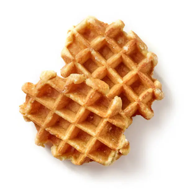 freshly baked belgian waffles isolated on white background, top view