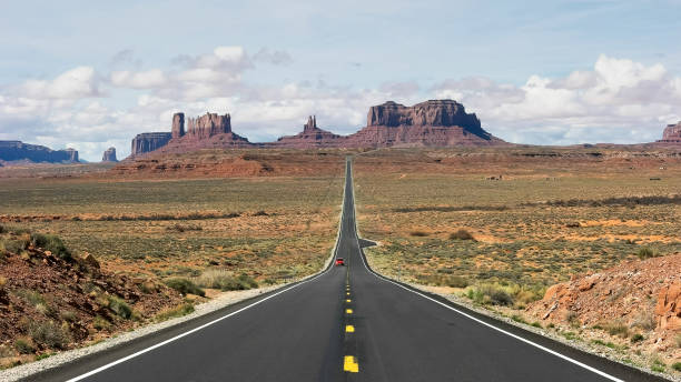 istock red car on highway 163 at monument valley 1162231686