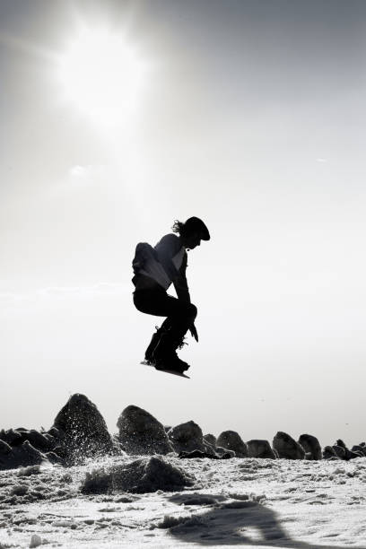 istock Snowboarder jumping in the air 1162233838