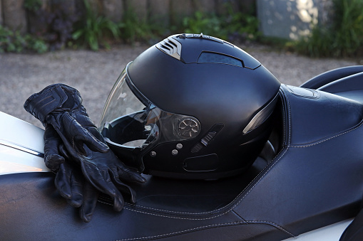 Protective clothing when riding a motorcycle. Motorcycle helmet and gloves are an important protection.