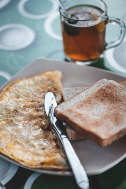 istock Omelet with toast and lemon tea 1162238413