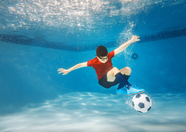 istock Kid underwater soccer 1162240602