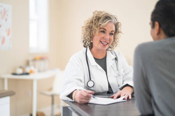 istock Doctor smiling at her patient 1162241325