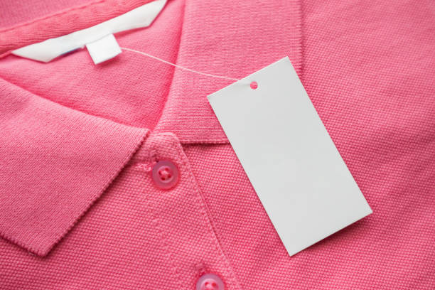 istock Blank white clothes tag label on new shirt 1162241628